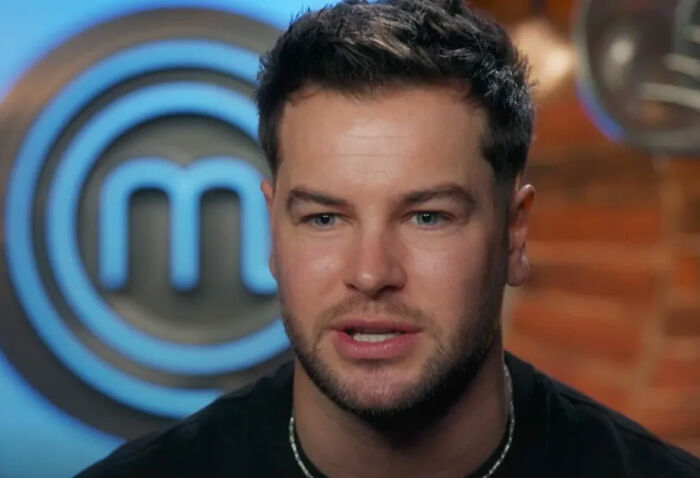 Chris Hughes speaking on reality TV show, capturing JoJo Siwa fans stunned and confused by his confession.