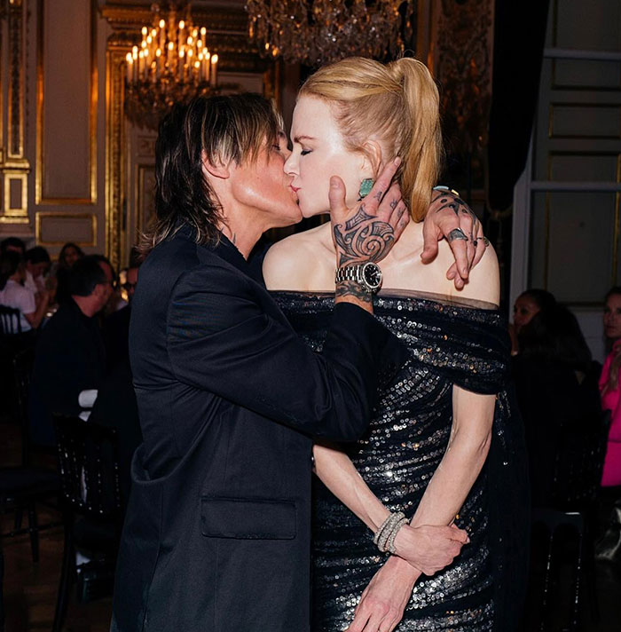 Nicole Kidman and a man sharing a kiss at an elegant event, highlighting moments linked to divorce criticism. Nicole Kidman and a man sharing a kiss at an elegant event, highlighting moments linked to divorce criticism.