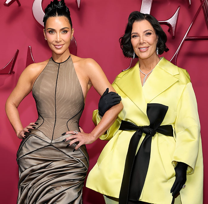Kim Kardashian and Kris Jenner posing at the All&rsquo;s Fair premiere with a red backdrop and elegant outfits.