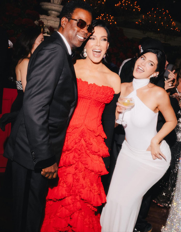 Guests smiling and posing at Kris Jenner's 70th birthday bash, showcasing the star-studded guest list attendees.