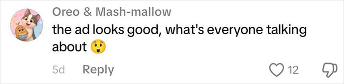 Comment saying the Coca-Cola holiday commercial ad looks good and questioning what everyone is talking about, with surprised emoji.