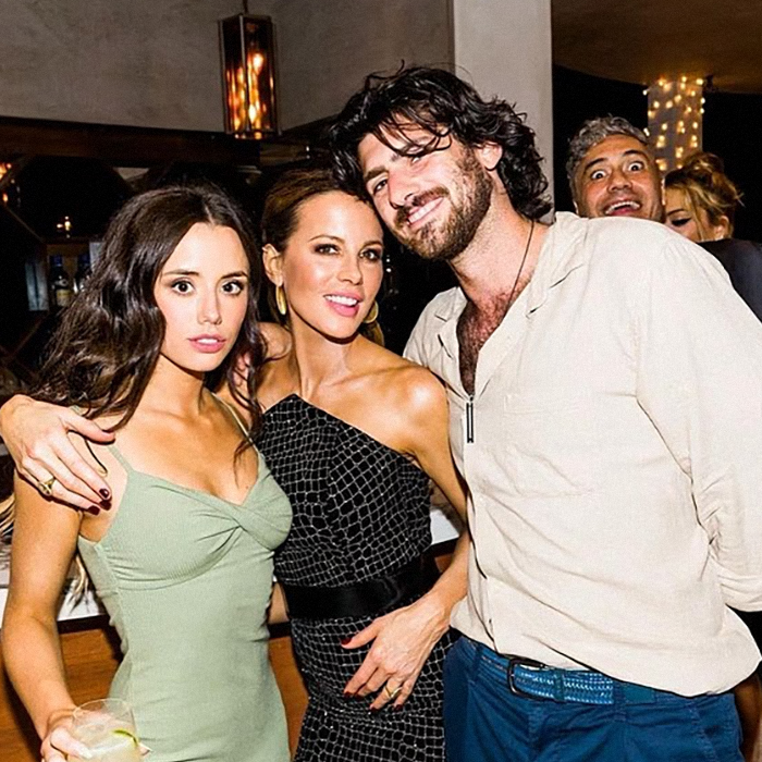 Kate Beckinsale smiling at an event with two friends, posing closely in stylish outfits, enjoying the night out. Kate Beckinsale smiling at an event with two friends, posing closely in stylish outfits, enjoying the night out.