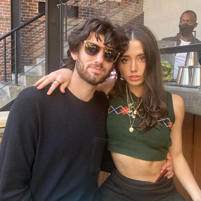 Couple posing indoors with casual outfits, highlighting Kate Beckinsale and her daughter's boyfriend in a candid moment. Couple posing indoors with casual outfits, highlighting Kate Beckinsale and her daughter's boyfriend in a candid moment.
