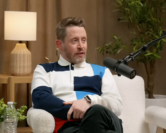 Man in a color-block shirt speaking into a microphone, sharing insights about the tragic My Girl scene filming. Man in a color-block shirt speaking into a microphone, sharing insights about the tragic My Girl scene filming.