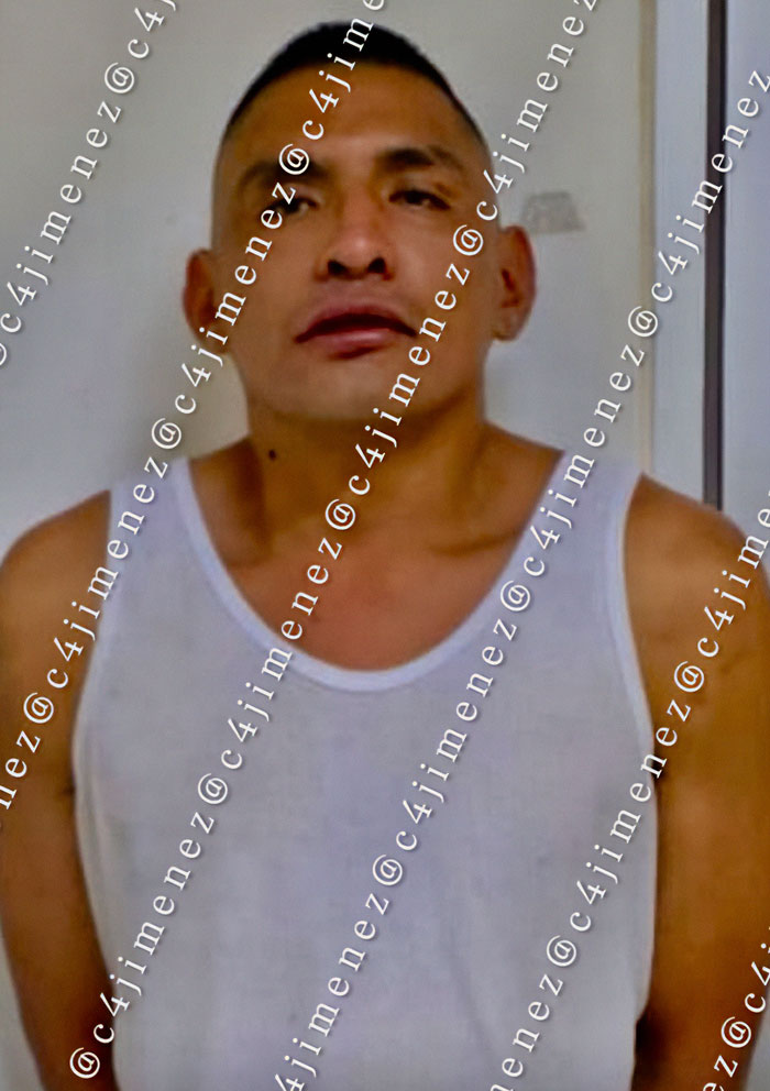 Man in white tank top, representing reality for a lot of women in Mexico involving the Mexican president situation.