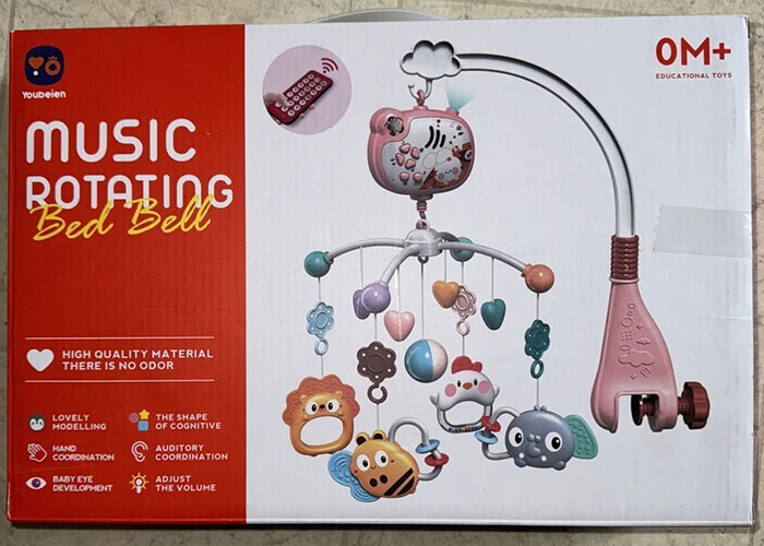 Baby crib music rotating bed bell toy displayed in packaging, highlighting potential medical malpractice lawyer concerns about safety risks.
