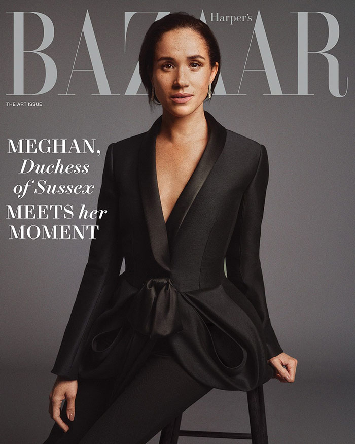 Meghan Markle posing in a black tailored suit for Harper’s Bazaar cover, linked to Princess Diana photo recreation controversy Meghan Markle posing in a black tailored suit for Harper’s Bazaar cover, linked to Princess Diana photo recreation controversy