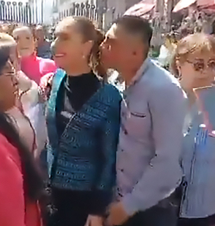 Man kisses and fondles Mexican president while she speaks to crowd, highlighting reality for many women in public settings.