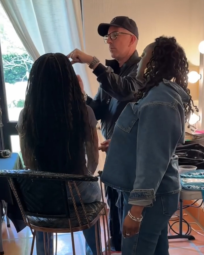 Michelle Obama with ultra-long hair getting her casual look styled by two hairstylists in a bright room. Michelle Obama with ultra-long hair getting her casual look styled by two hairstylists in a bright room.