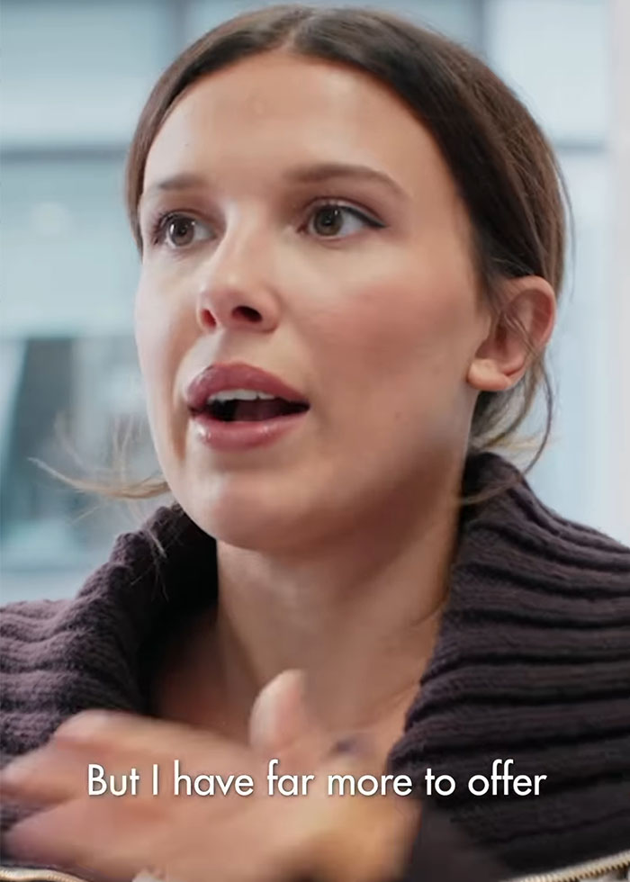 Millie Bobby Brown speaking in an interview, addressing adoption and criticism at age 21 with a focused expression. Millie Bobby Brown speaking in an interview, addressing adoption and criticism at age 21 with a focused expression.