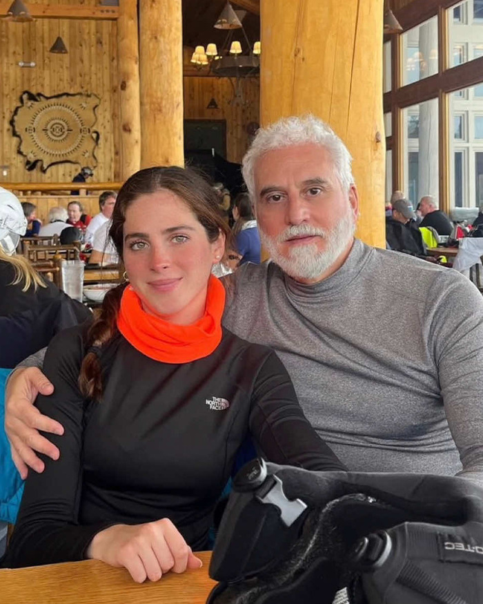 A man and a woman sitting closely in a wooden lodge, illustrating leaned on the victim narrative backlash discussion.