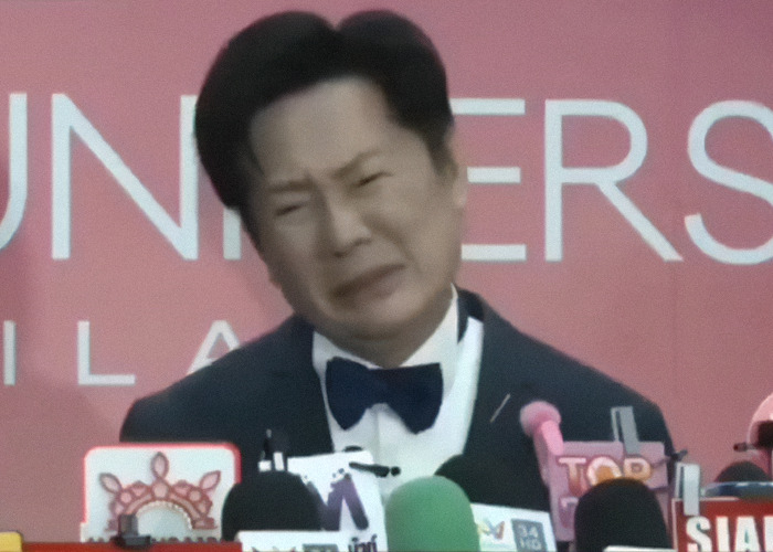 Man in tuxedo speaking at Miss Universe event, amid drama involving Miss Mexico and controversial VP comment.