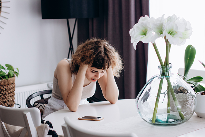 Young woman frustrated and upset at home, highlighting family conflict and struggles with irresponsible sister and future hopes. Young woman frustrated and upset at home, highlighting family conflict and struggles with irresponsible sister and future hopes.