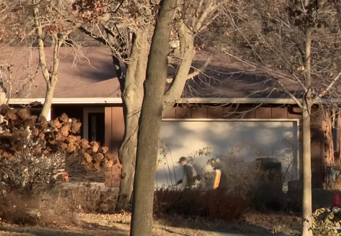 Police officers investigating outside a suburban home during the Slender Man attacker nationwide manhunt. Police officers investigating outside a suburban home during the Slender Man attacker nationwide manhunt.