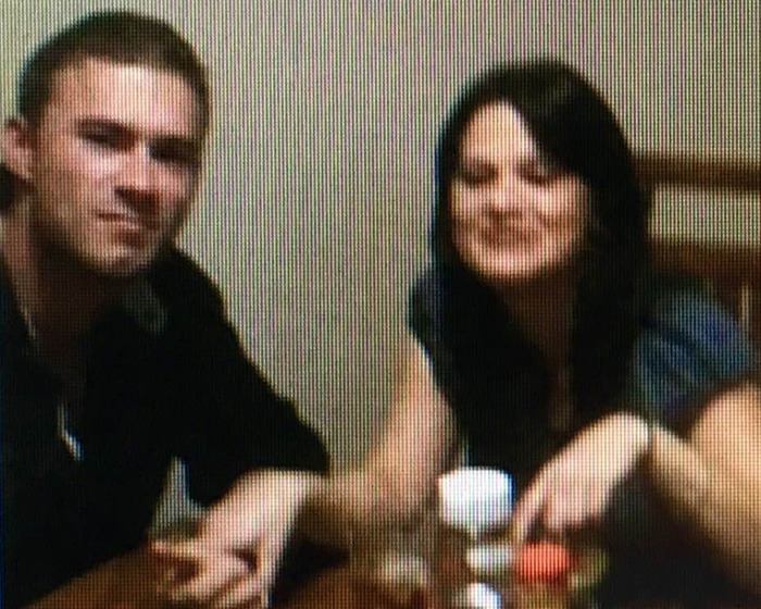 A woman and young man sitting at a table with drinks, related to mom&rsquo;s claim about skinned body in Las Vegas museum.