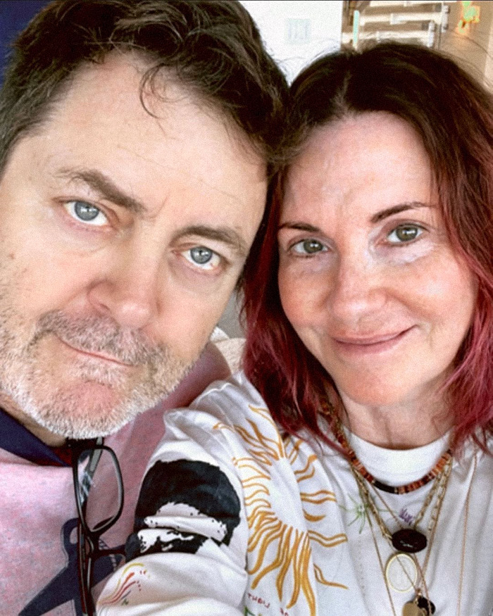 Nick Offerman with a woman, both smiling in a close-up selfie, related to X-rated comment during live broadcast incident.