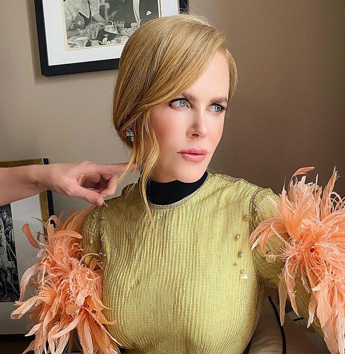 Nicole Kidman in gold dress with feathered sleeves, getting hair styled, highlighting Tom Cruise and Nicole Kidman split news.