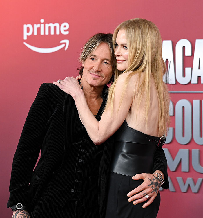 Nicole Kidman and Keith Urban embracing on red carpet, related to Tom Cruise and karma news.