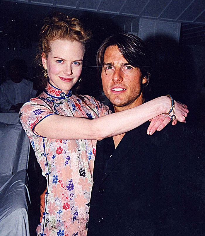 Nicole Kidman and Tom Cruise posing together at a formal event, highlighting Tom Cruise karma and split discussions.