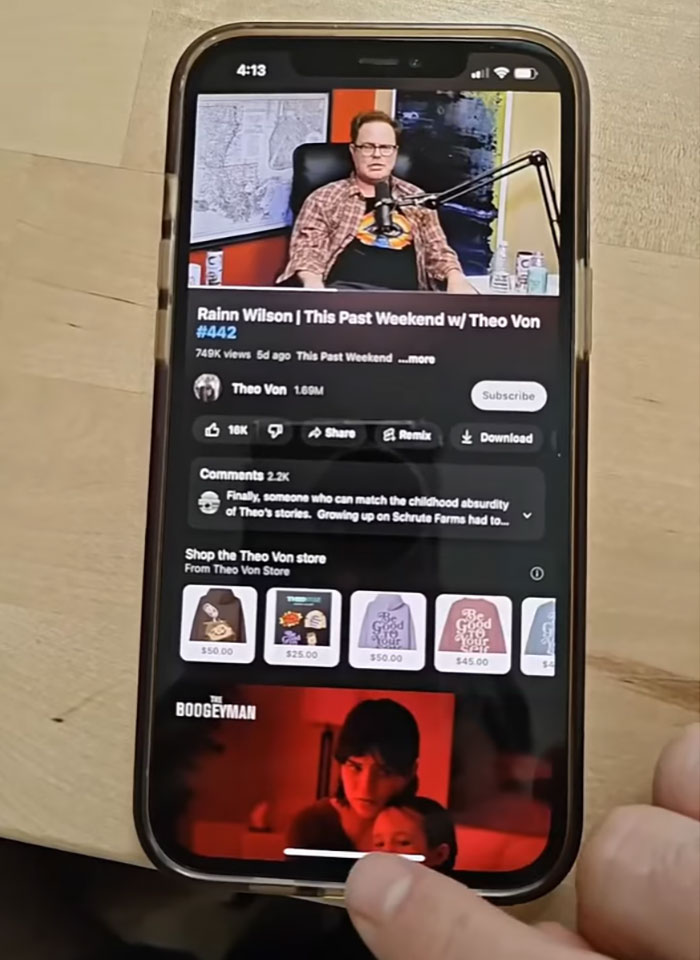 Smartphone screen showing a podcast video and merchandise, illustrating people finding a lucrative loophole to exploit unapologetically.