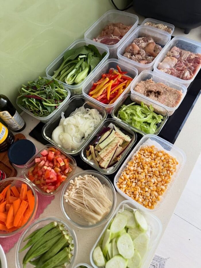 Meal prep containers filled with fresh vegetables and meats, showcasing kitchen tips and tricks for better cooking skills.