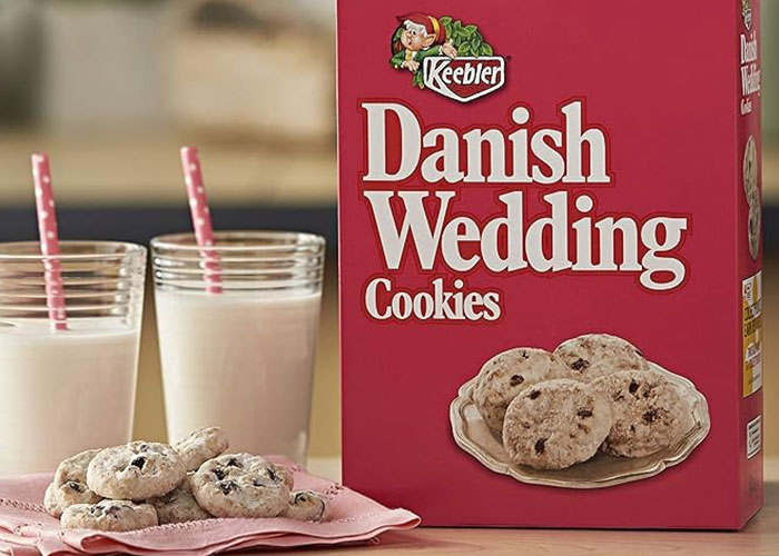 Keebler Danish Wedding Cookies box with cookies and two glasses of milk, highlighting discontinued foods people miss.