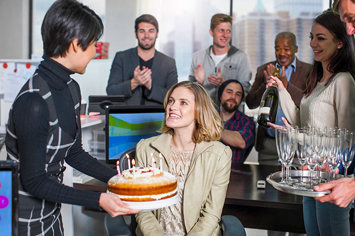 Coworkers celebrating a birthday in the office while the organizer faces Venmo ghosting and no birthday contributions.