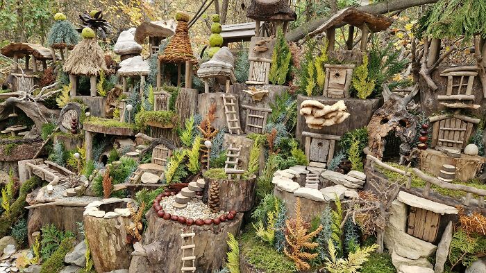 Miniature fantasy village made of natural materials showcasing fictional worlds in a famous movie settings quiz concept.