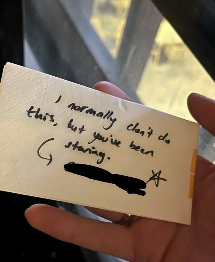 Hand holding a handwritten note with a message, illustrating messy times people turn to the internet instead of therapy.