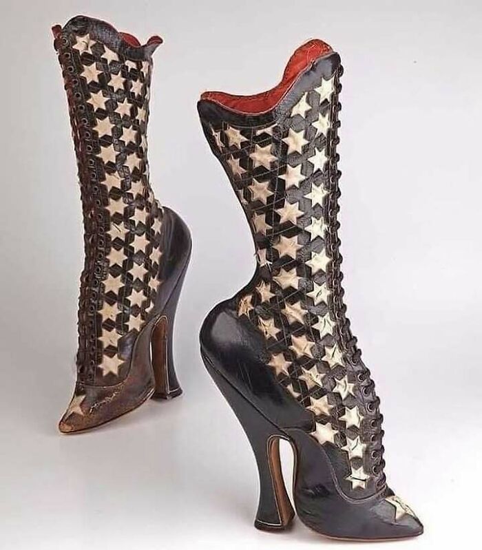 Very old high-heeled boots with star patterns, showcasing vintage craftsmanship and design from ancestors' era.