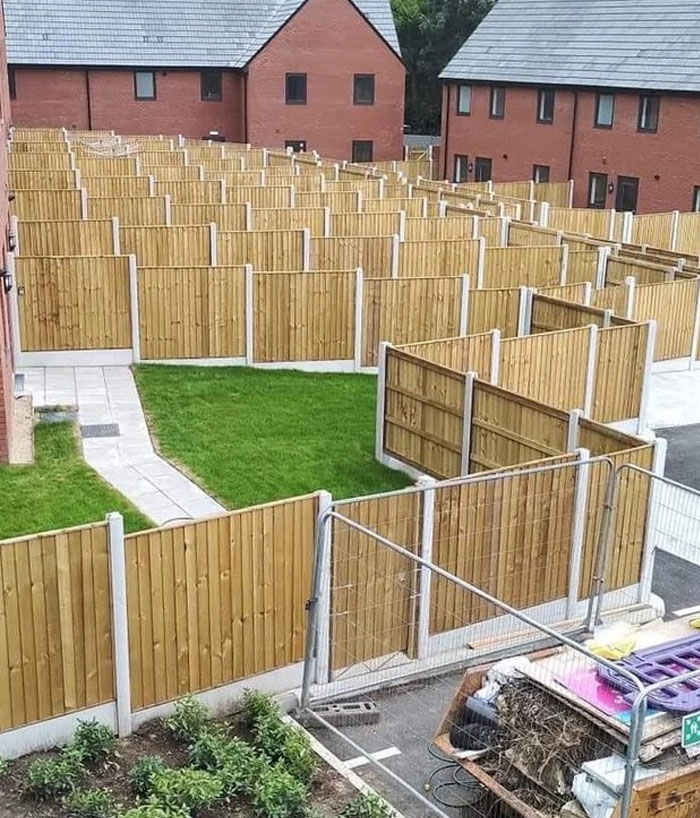 A confusing design and architecture nightmare showing fenced yards with impossible access paths between houses.