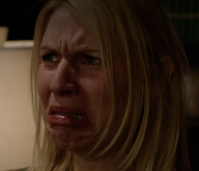 Claire Danes with a quivering chin, showing intense emotion in a dramatic scene from her new hit show.