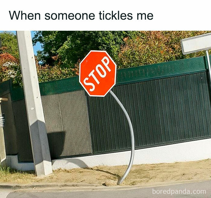Bent stop sign on a street corner with text about tickling, illustrating self-deprecating memes feel personally attacked humor.