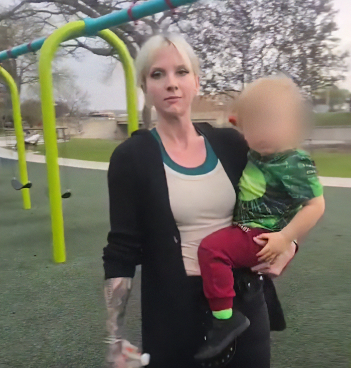 Woman holding child at playground linked to viral mom who called autistic boy the n-word in disturbing clash trial