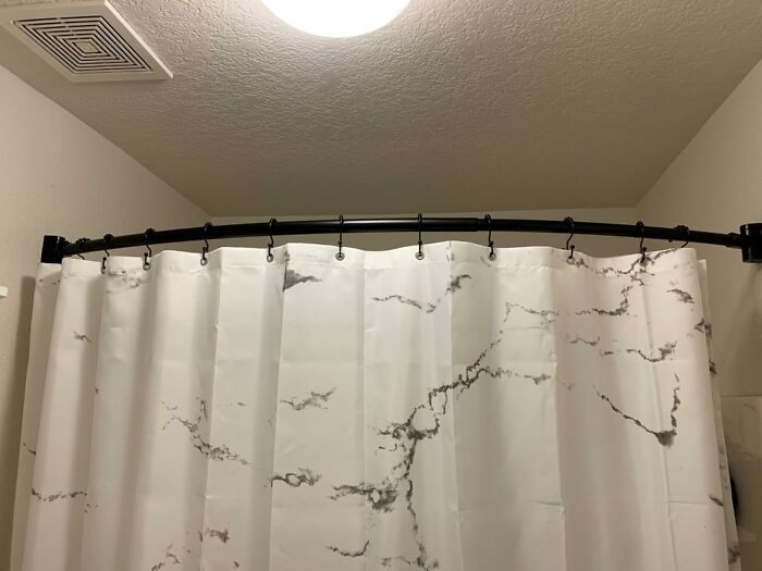  The Cold, Clammy Shower Curtain's Daily Attempt To Personally Attack You Is Finally Over Thanks To This Curved Shower Curtain Rod 