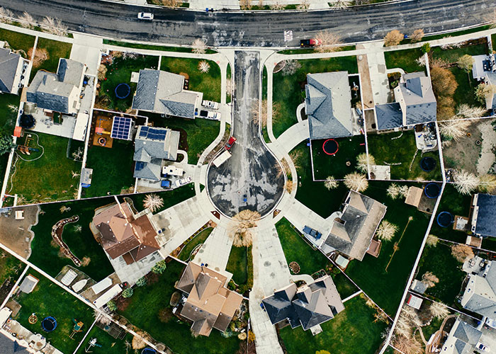 Aerial view of suburban neighborhood cul-de-sac illustrating HOA community setting for HOA president conflict.