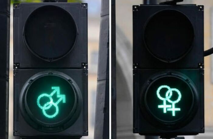 Traffic lights showing gender symbols in green, illustrating strange facts and images that show how unusual our world is.