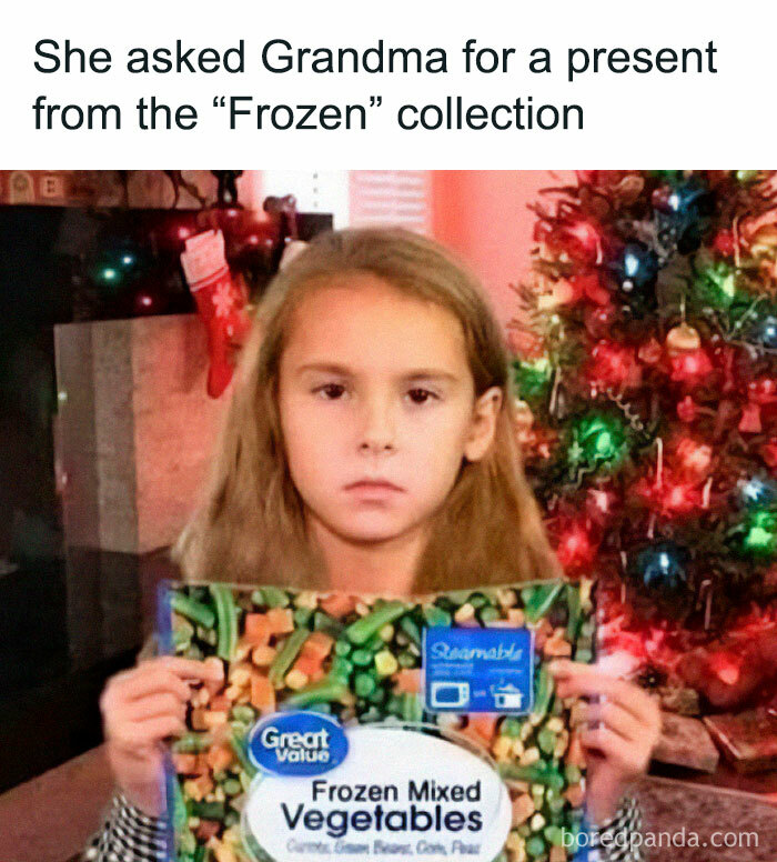 A girl holding a bag of frozen mixed vegetables by a Christmas tree, a funny stupid food meme for stupid people.