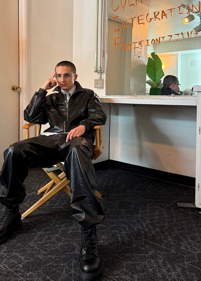Timothée Chalamet in black leather outfit sitting in a chair, enjoying a relaxed guys’ night out in Hollywood. Timothée Chalamet in black leather outfit sitting in a chair, enjoying a relaxed guys’ night out in Hollywood.