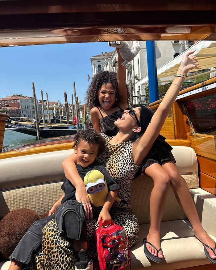 Three joyful people on a boat enjoying a sunny day in Venice, capturing a fun and lively moment outdoors. Three joyful people on a boat enjoying a sunny day in Venice, capturing a fun and lively moment outdoors.