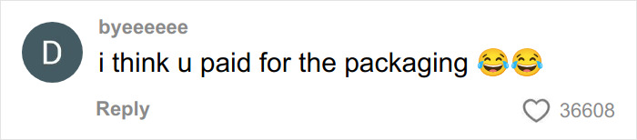 Comment text saying i think u paid for the packaging with two laughing emojis expressing criticism of Dior advent calendar.