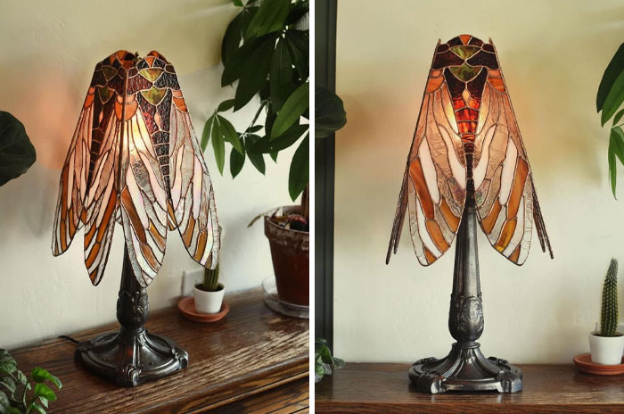 Vintage stained glass lamp shaped like a cicada with intricate design, showcasing very old objects connected to ancestors.