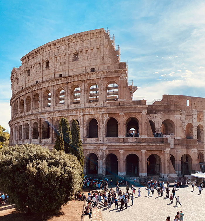 Ancient Colosseum with tourists outside, highlighting solo female travelers do not recommend this historical place.