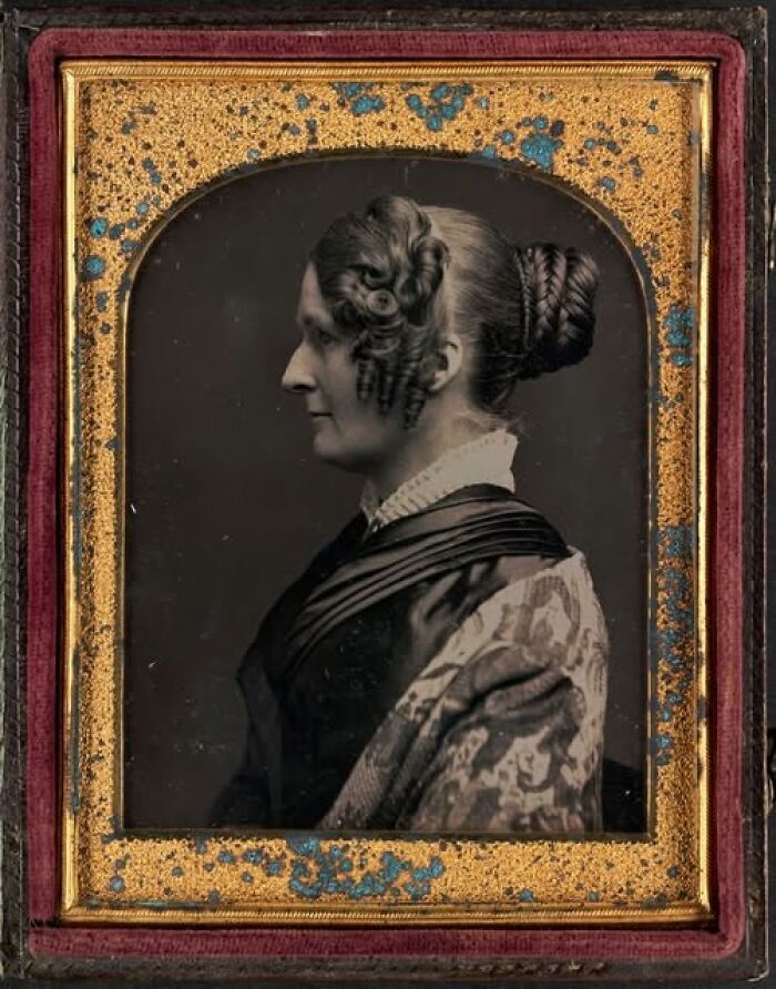 Victorian-Edwardian pictures of a woman with styled hair and patterned shawl in a vintage ornate frame portrait.