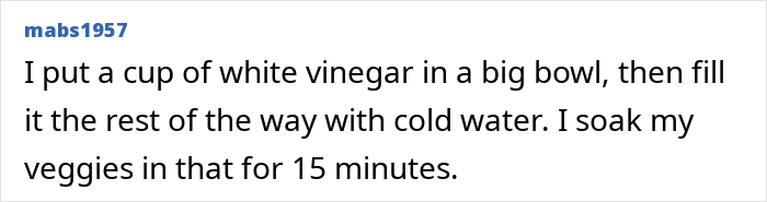 Bowl of vegetables soaking in water with white vinegar for washing tips when buying fruits and vegetables from the store