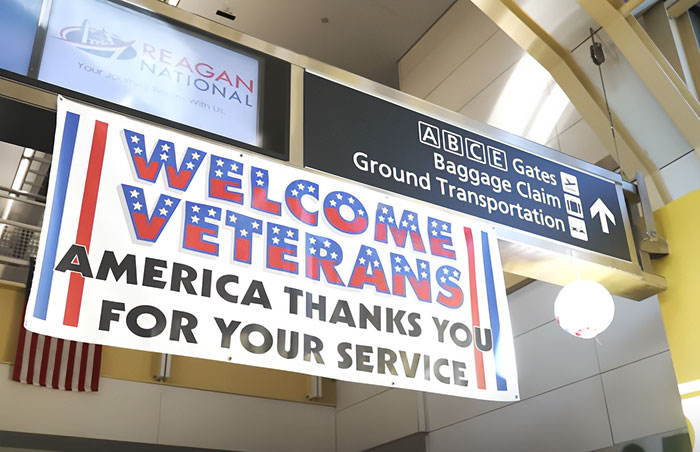 Welcome veterans banner at Reagan National airport, honoring war veterans with gratitude for their service.