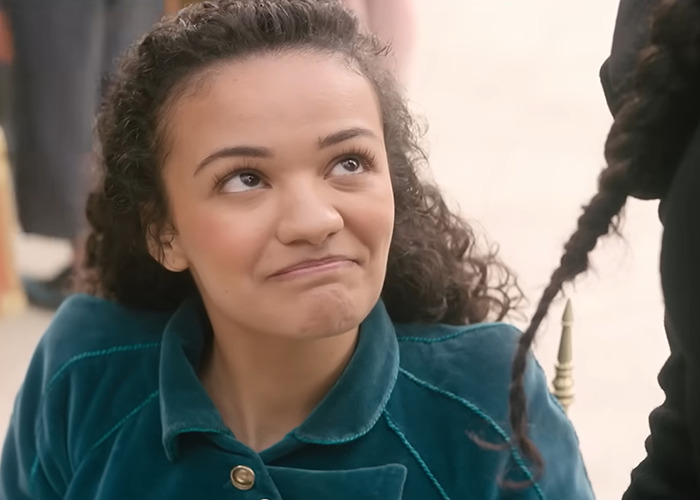 Actress from Wicked cast reacting in a candid moment during a discussion on disability inclusion and viral selfie controversy.