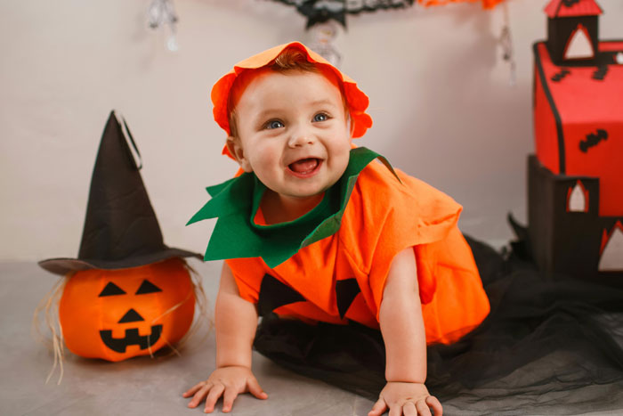 Baby dressed as pumpkin at Halloween party, mom brings baby to sister&rsquo;s 400-person Halloween bash amid partner&rsquo;s concerns.