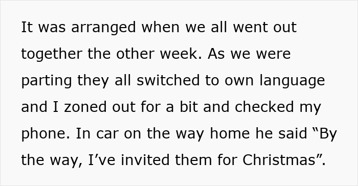 Woman looking frustrated in kitchen, avoiding cooking a foreign traditional Christmas spread meal.