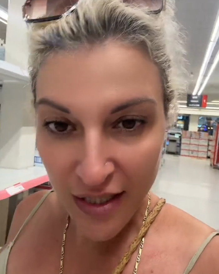 Woman speaking in a store about decency in public and the viral rant on gross activewear trends dividing opinions online.